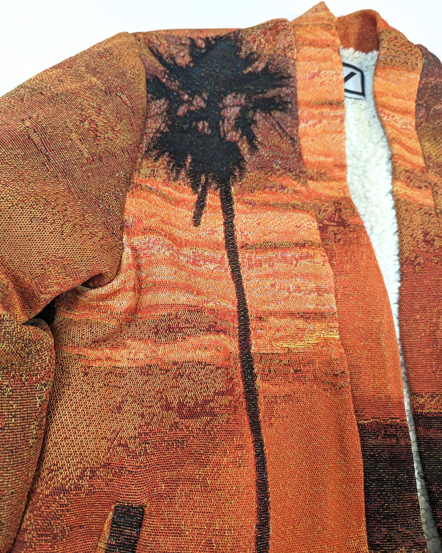 REVERSIBLE FLEECE TAPESTRY CARDIGAN IN SUNSET